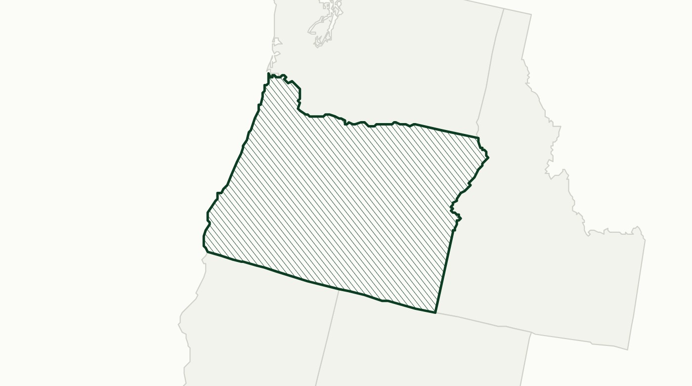 A map of Oregon drawn in fine dark green hatching under a solid outline, with the neighbouring states of Washington, Idaho, Nevada and California in faint grey outline.